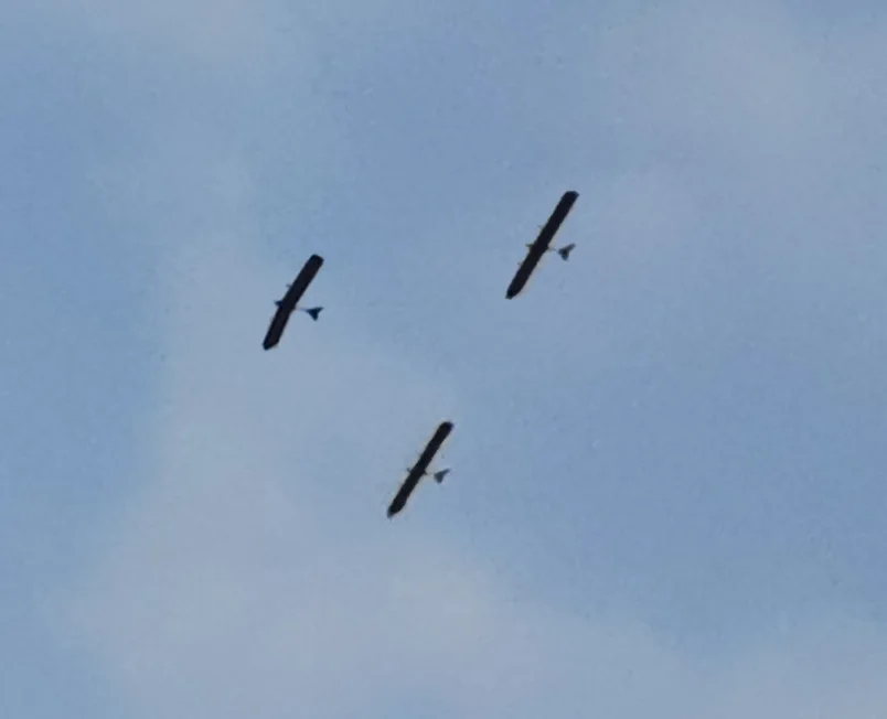 Three solar aircraft flying in formation