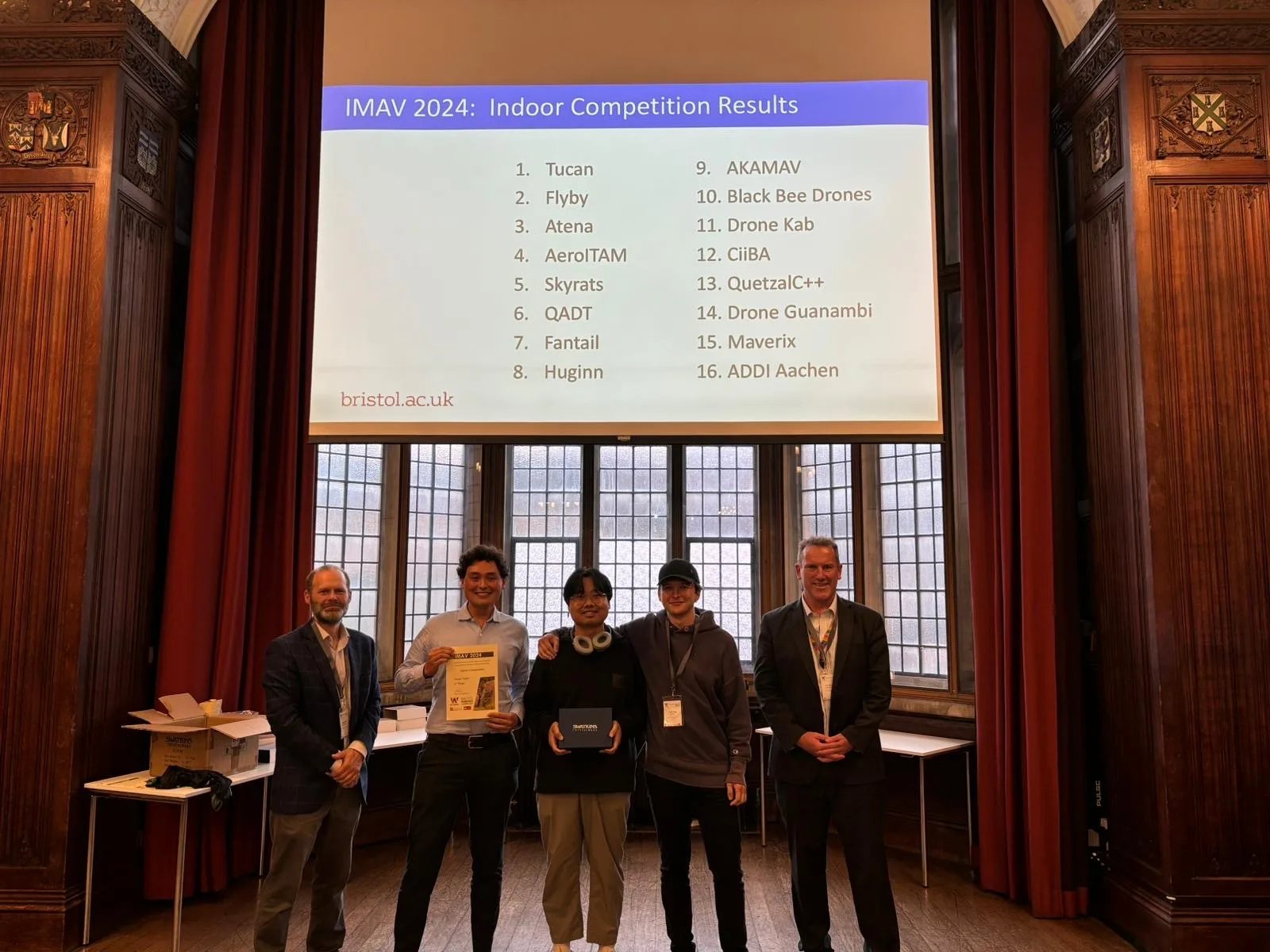 Liming Zheng and Team Tucan receiving the IMAV 2024 indoor competition award
